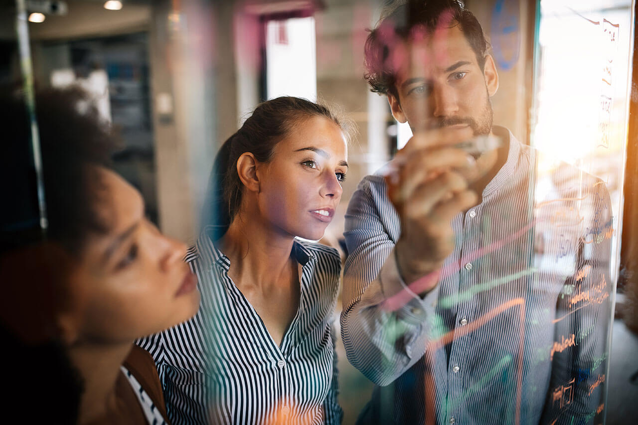 Three Young business people strategizing